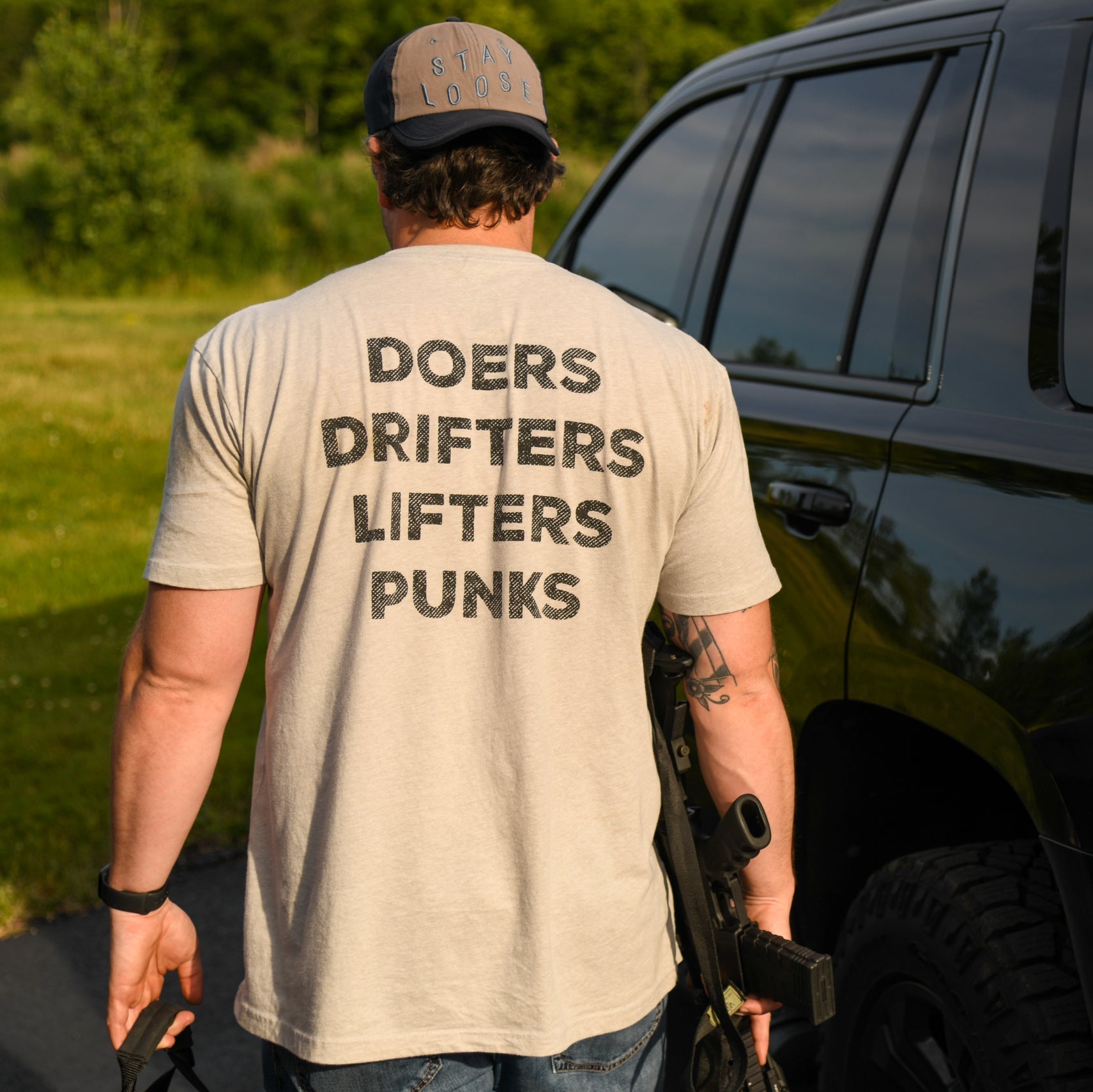 "Doers Drifters Lifters Punks" - Unisex Tee