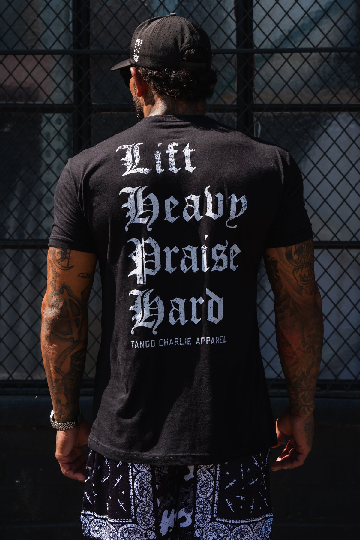Lift Heavy. Praise Hard. Black Tee