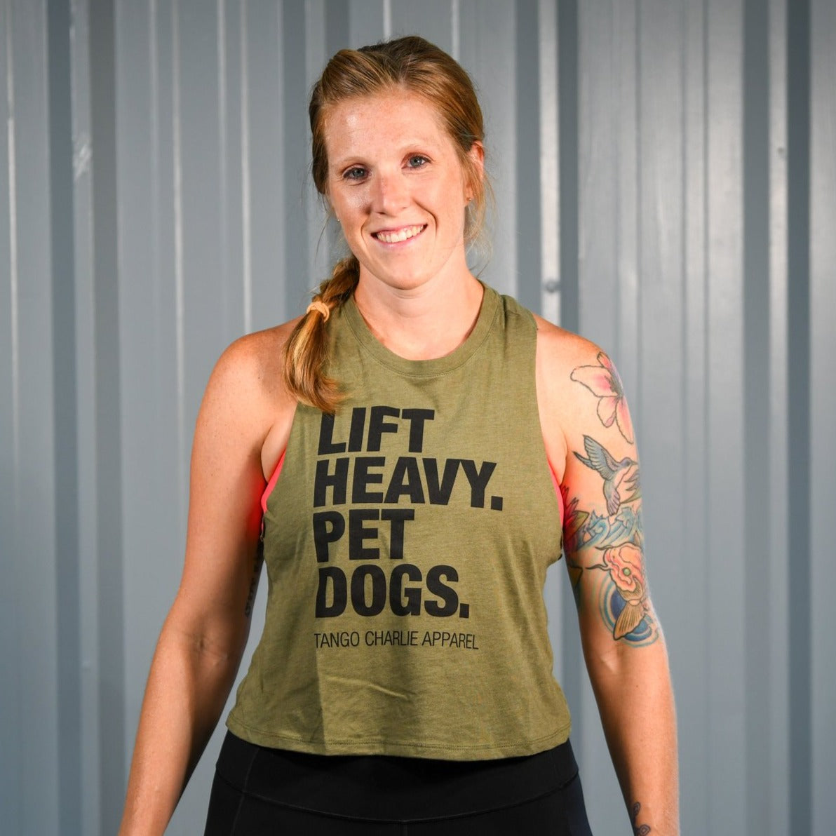 Lift Heavy. Pet Dogs. - Women’s Racerback Crop Tank