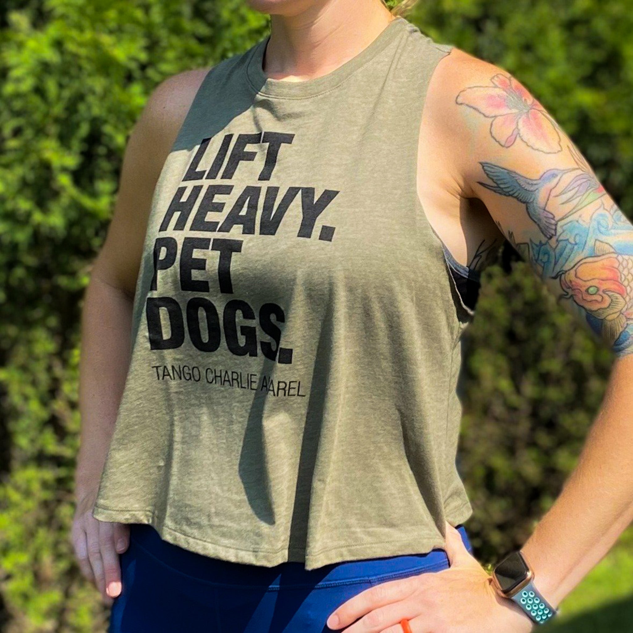 Lift Heavy. Pet Dogs. - Women’s Racerback Crop Tank